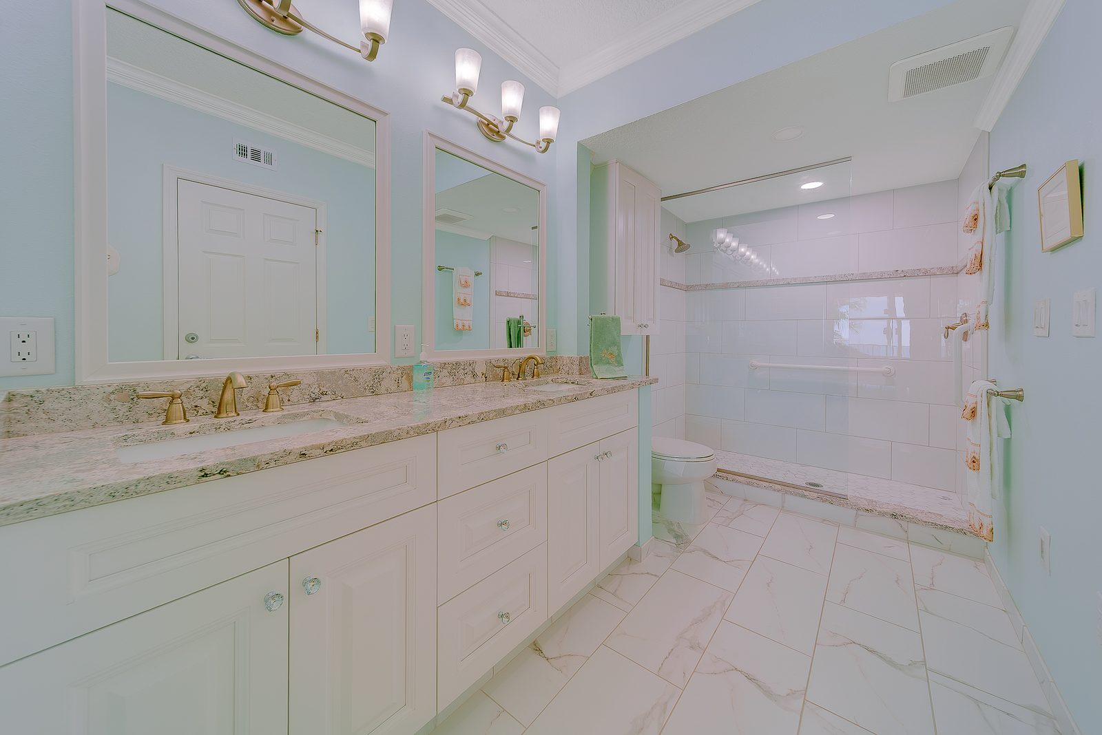 Renovated primary bathroom with double vanity